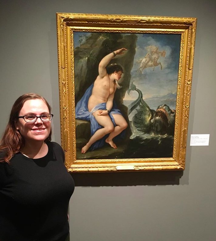 Dr. Sarah Cantor stands in front of the painting "Andromeda and Perseus" at the Fairfield University Art Museum.